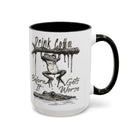 White ceramic mug with a black handle and rim, featuring a frog hanging from a branch over a gator.