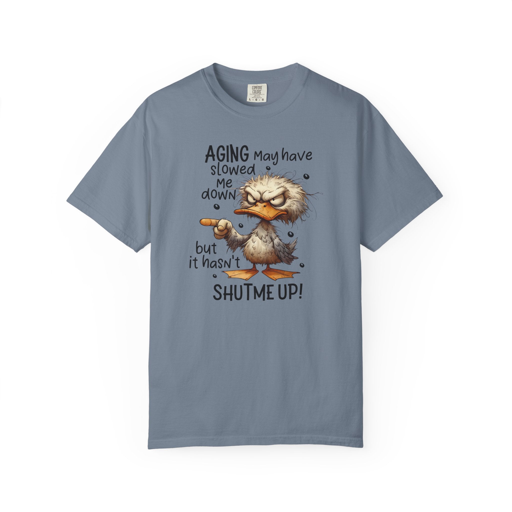 A blue heavyweight cotton t-shirt featuring a grumpy duck illustration and text about aging.