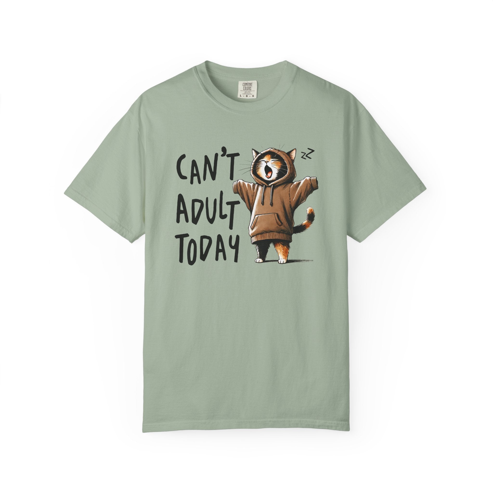 A sage green heavyweight cotton t-shirt featuring a graphic of a yawning cat in a brown hoodie.