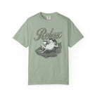Sage green unisex t-shirt with a distressed graphic of a frog wearing sunglasses on a lily pad.