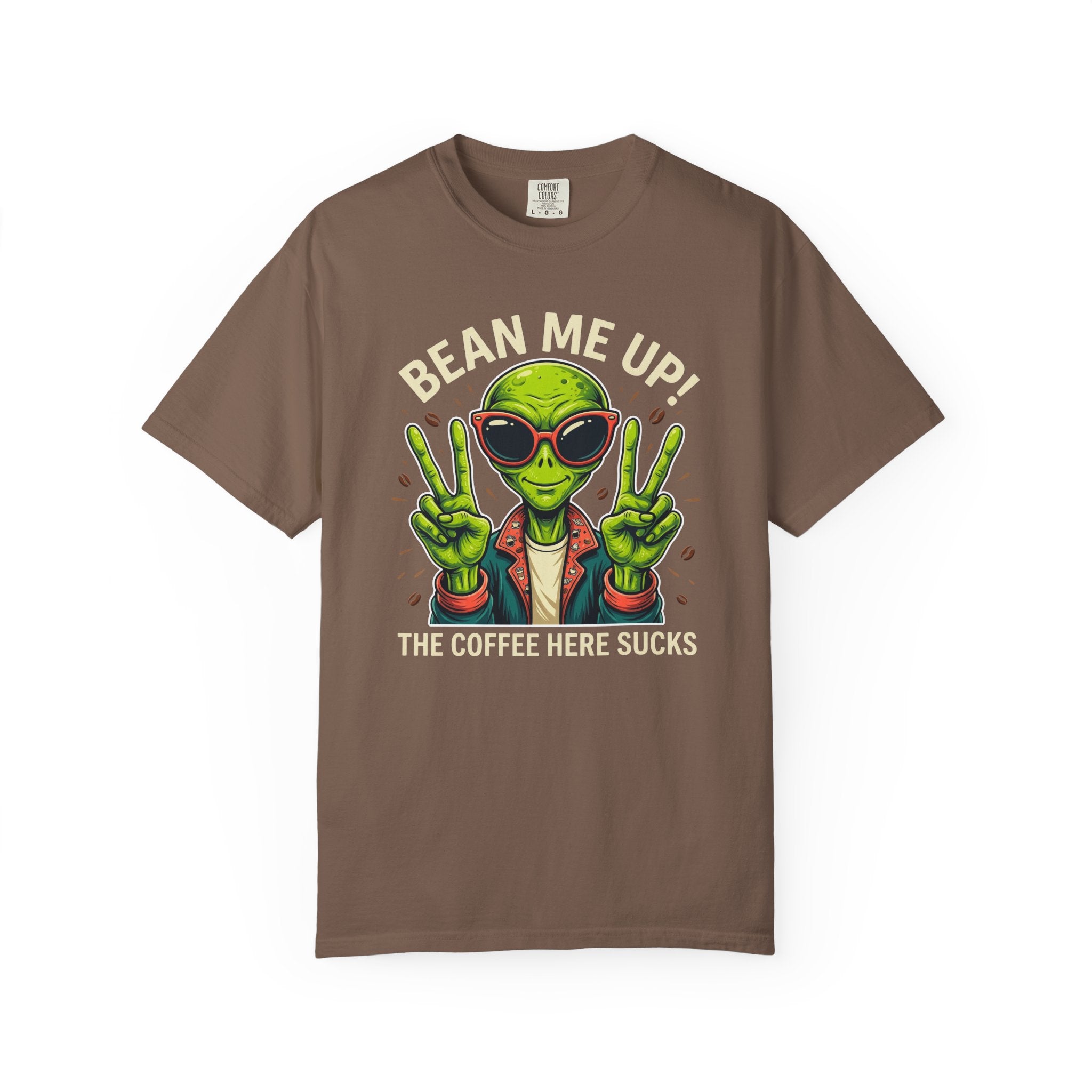 Brown t-shirt featuring a cartoon alien wearing sunglasses and making peace signs with text.