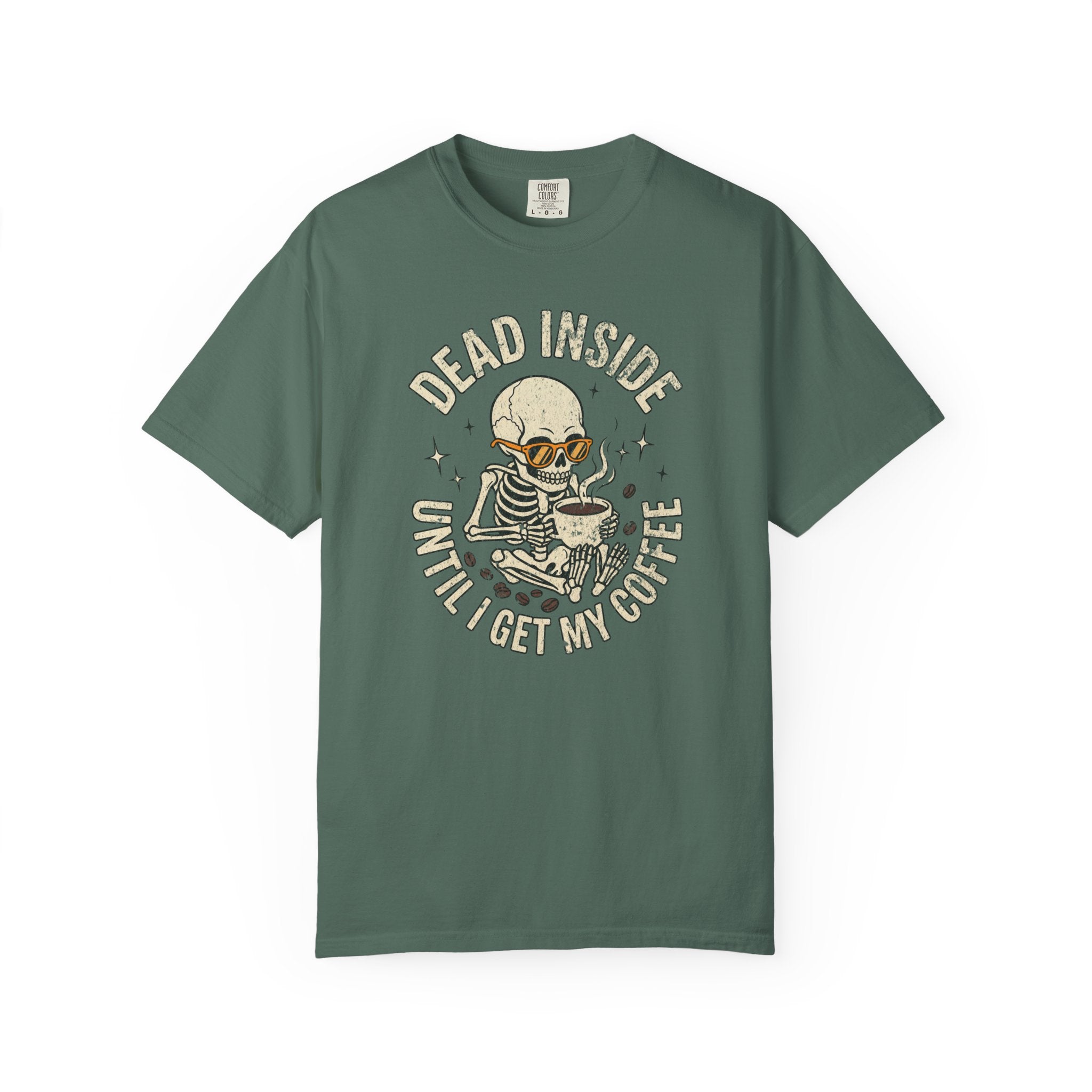 Green t-shirt with a distressed graphic of a skeleton wearing sunglasses and holding a coffee mug.