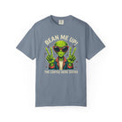 Blue-grey t-shirt featuring a green alien wearing sunglasses and making peace signs.