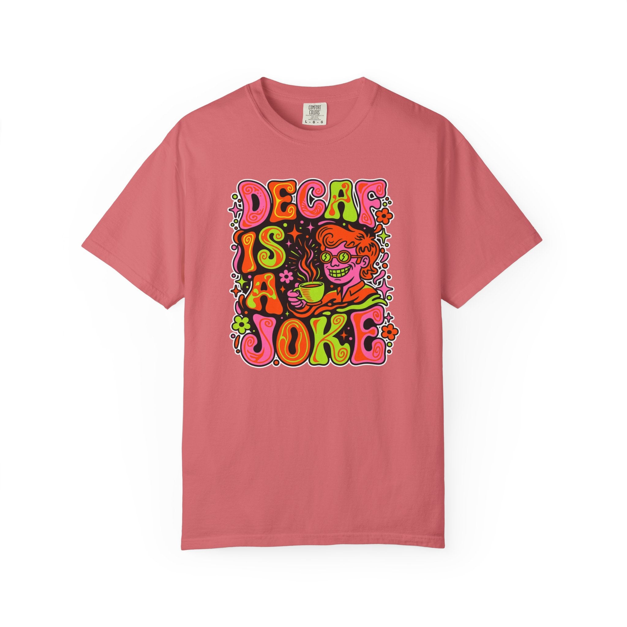 A coral-colored t-shirt featuring a retro, psychedelic graphic that says Decaf Is A Joke.