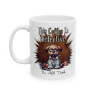 A white ceramic mug featuring a grumpy dog illustration and the text This Coffee Is Defective.