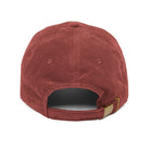Back view of a red corduroy baseball cap with an adjustable brass buckle strap.