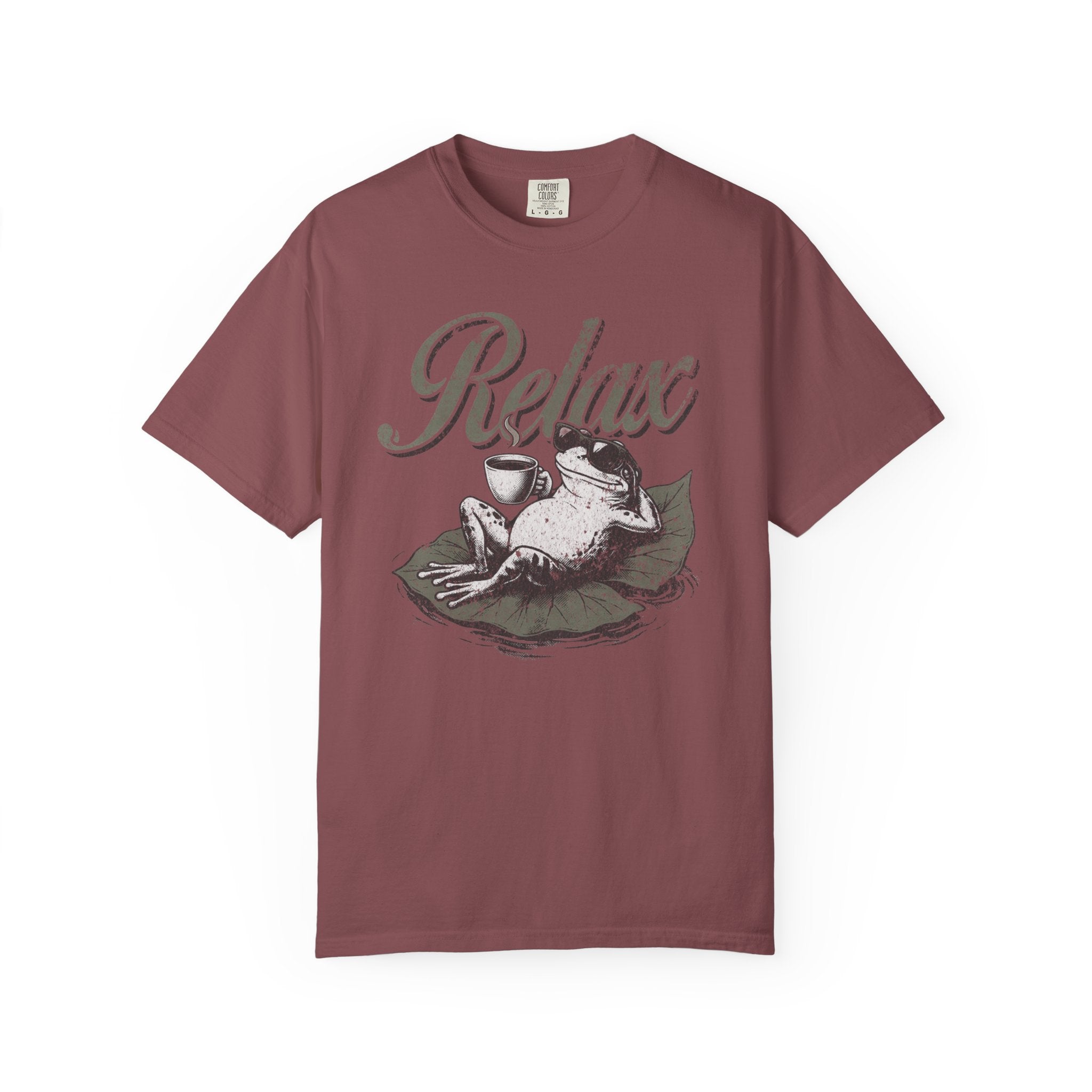 A maroon unisex t-shirt featuring a graphic of a frog wearing sunglasses and holding a coffee cup.