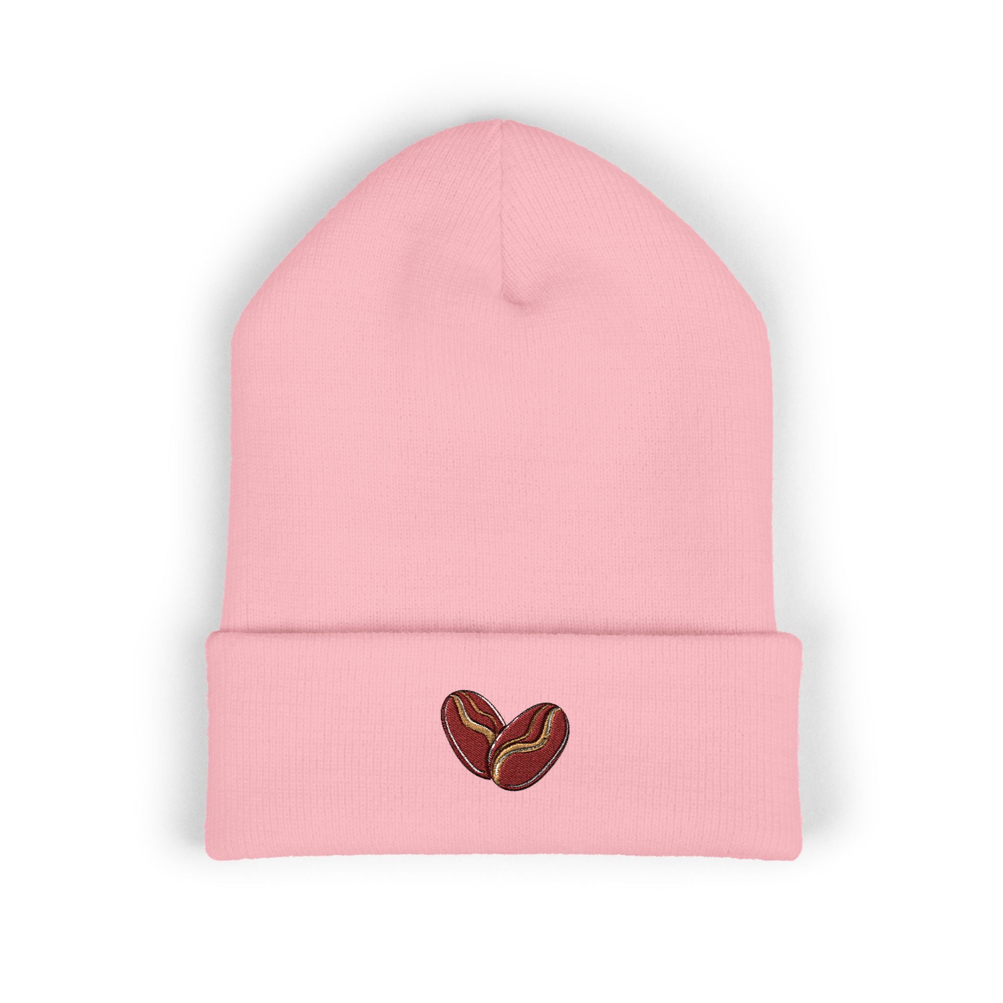 A pink cuffed beanie with two embroidered coffee beans on the cuff.