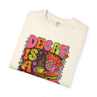 Cream-colored t-shirt featuring a retro psychedelic graphic with the text Decaf Is A Joke.