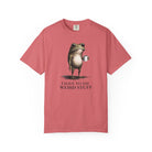 A dusty rose cotton t-shirt featuring a graphic of a frog holding a coffee mug with text below.