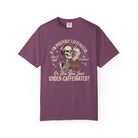 Purple t-shirt featuring a graphic of a skeleton wearing a bandana and holding a coffee mug.