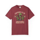 A maroon unisex cotton t-shirt featuring a distressed graphic of an alien making peace signs.