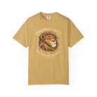 Mustard yellow t-shirt with a distressed graphic of a lion wearing a bandana and coffee text.