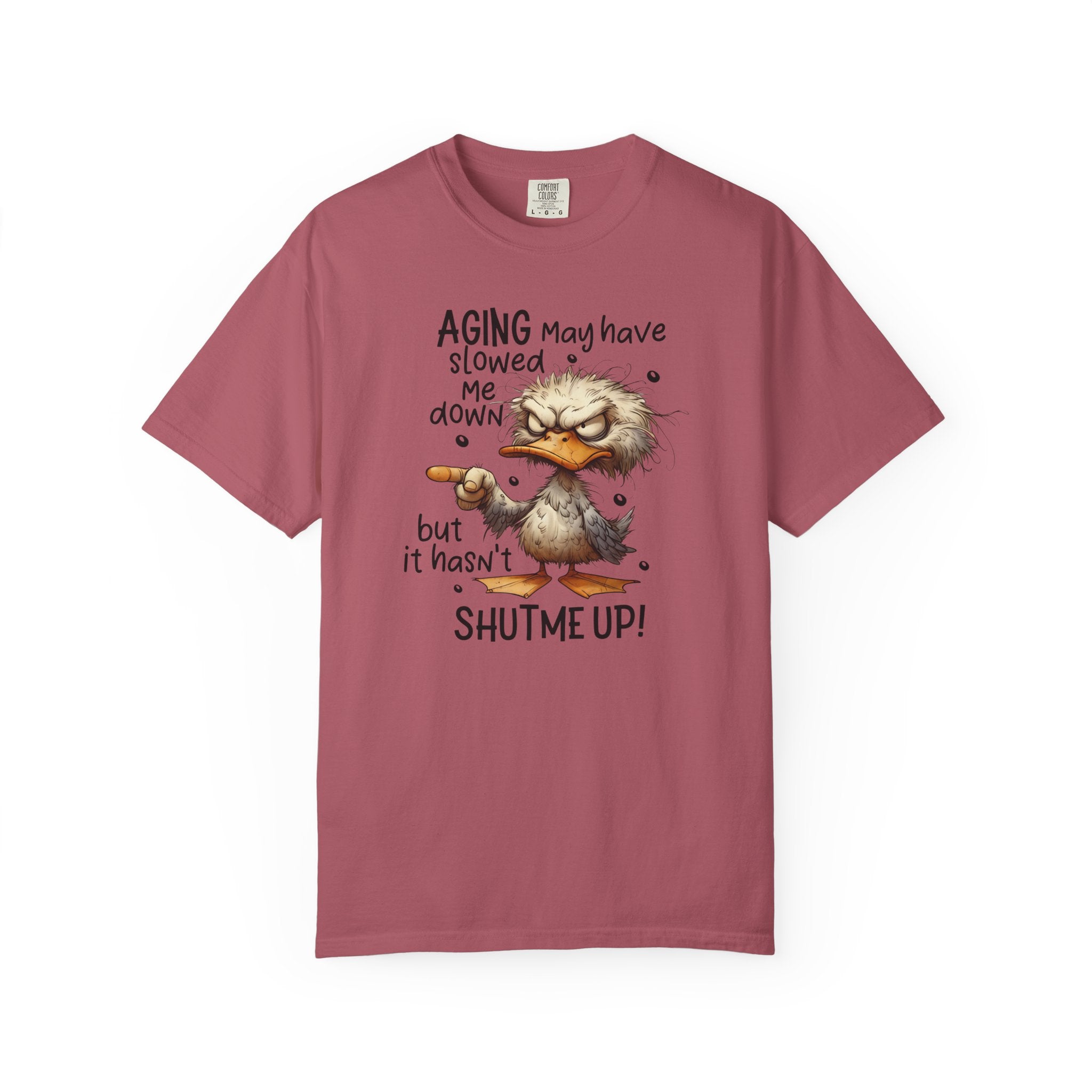A dusty rose heavyweight cotton t-shirt featuring a grumpy duck graphic and humorous text.