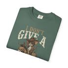 Green unisex cotton t-shirt featuring a distressed graphic of a cowboy rat riding a donkey.