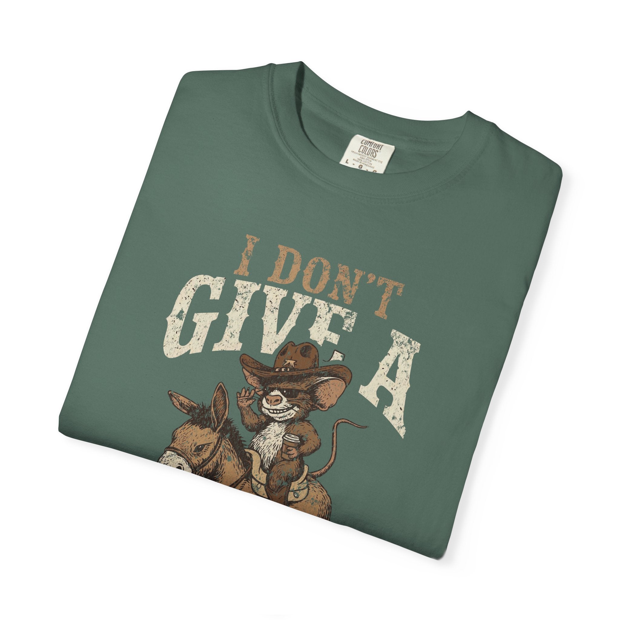 Green unisex cotton t-shirt featuring a distressed graphic of a cowboy rat riding a donkey.