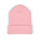 Pink cuffed knit beanie with a small embroidered coffee bean detail.