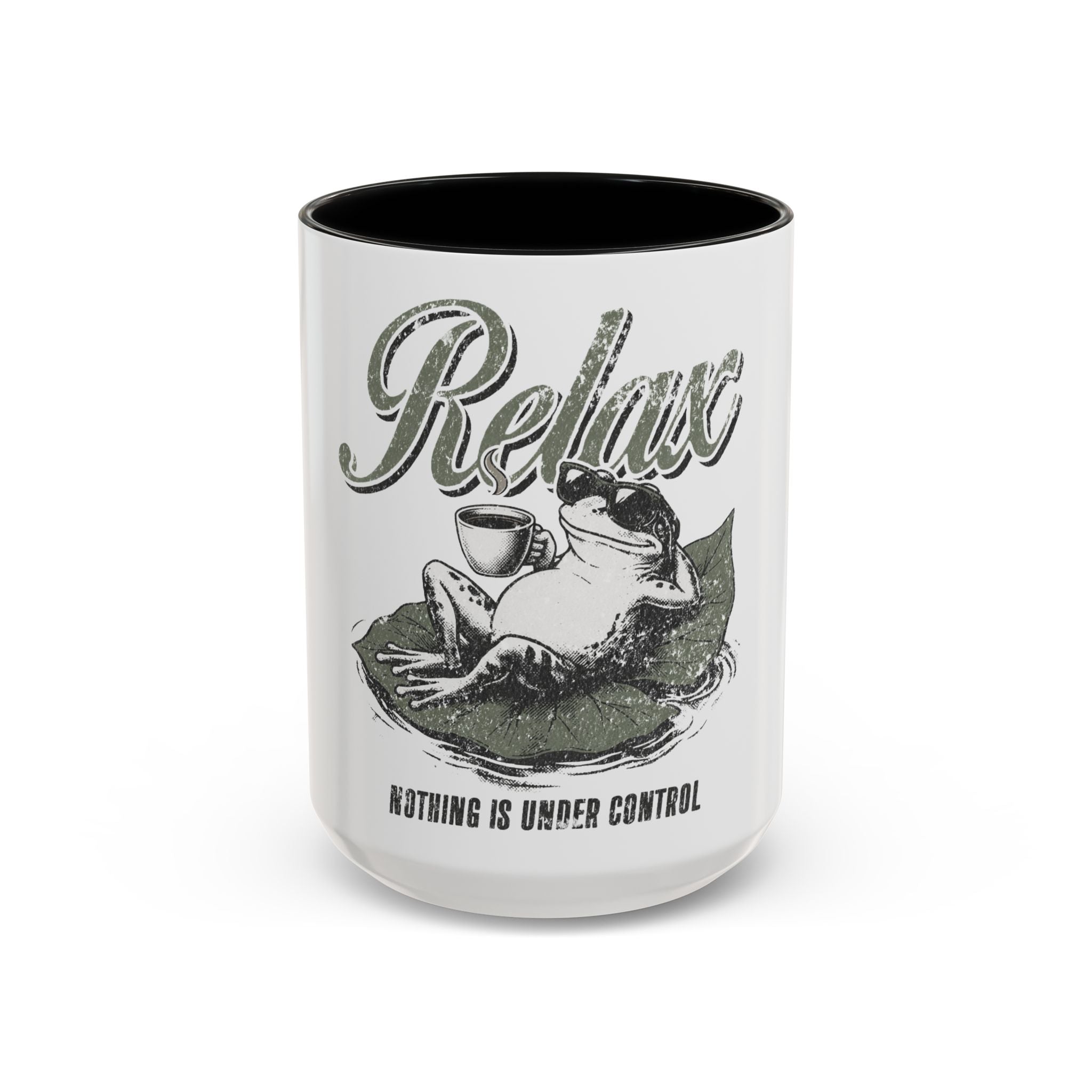 White ceramic mug with a black rim featuring a frog wearing sunglasses on a leaf with coffee.