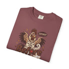 A folded maroon unisex cotton t-shirt featuring a distressed graphic of a grumpy rooster.