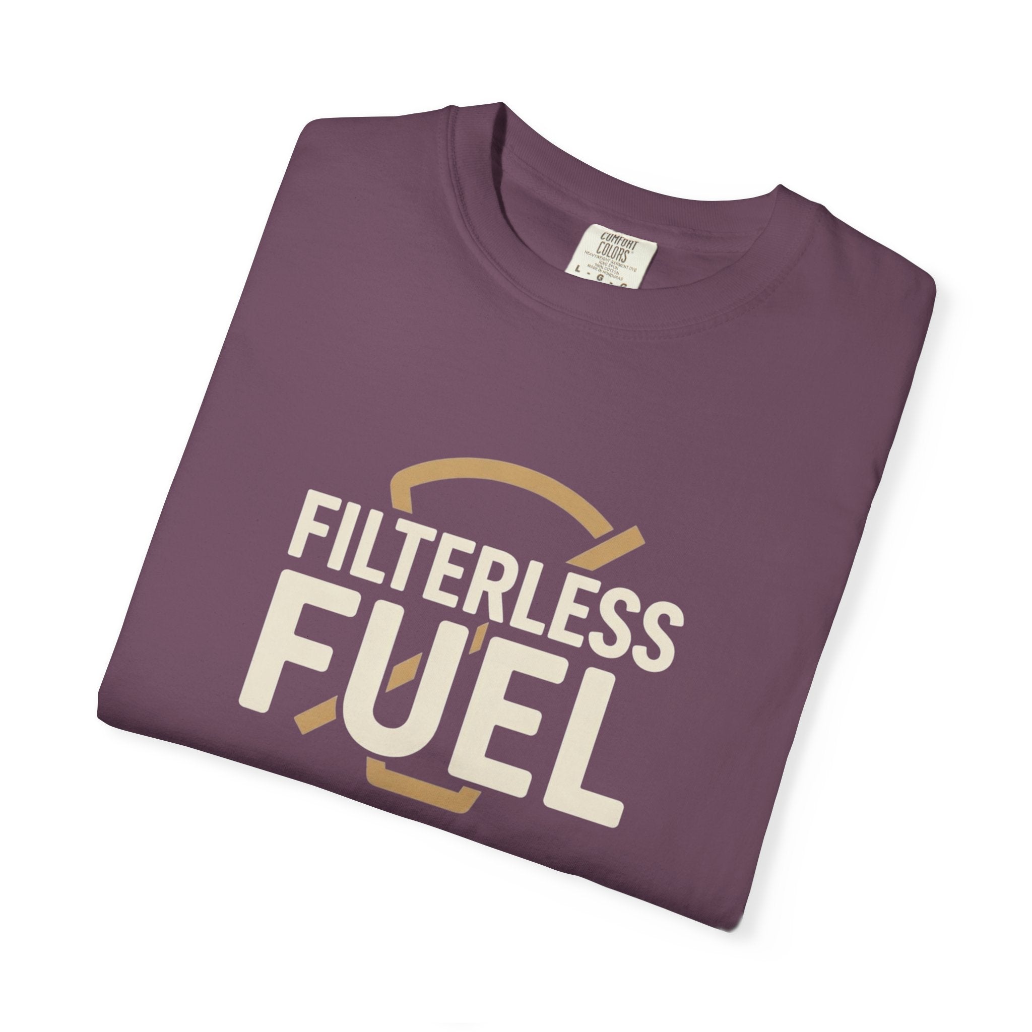 A folded plum-colored cotton t-shirt featuring the text Filterless Fuel in a retro design.