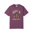 Purple unisex t-shirt with a distressed graphic of a cowboy rat riding a donkey, drinking coffee.
