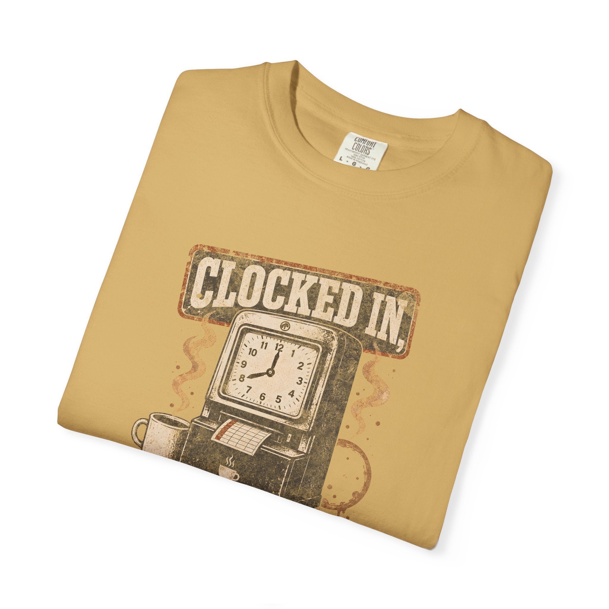 Folded mustard-colored Comfort Colors t-shirt with a vintage clock and coffee graphic.