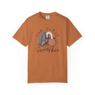 Rust-colored unisex t-shirt featuring a graphic of a bird with its head in a coffee mug.