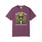 Purple t-shirt with a retro graphic of an alien wearing sunglasses and giving peace signs.