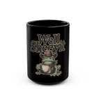 Black ceramic mug featuring a graphic of a cowboy frog holding a coffee cup with text Well Sheeyit.