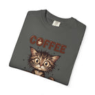 A charcoal grey unisex cotton t-shirt featuring a graphic of a wide-eyed, fluffy kitten.