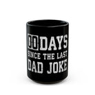 A black coffee mug with the white text 00 DAYS SINCE THE LAST DAD JOKE.