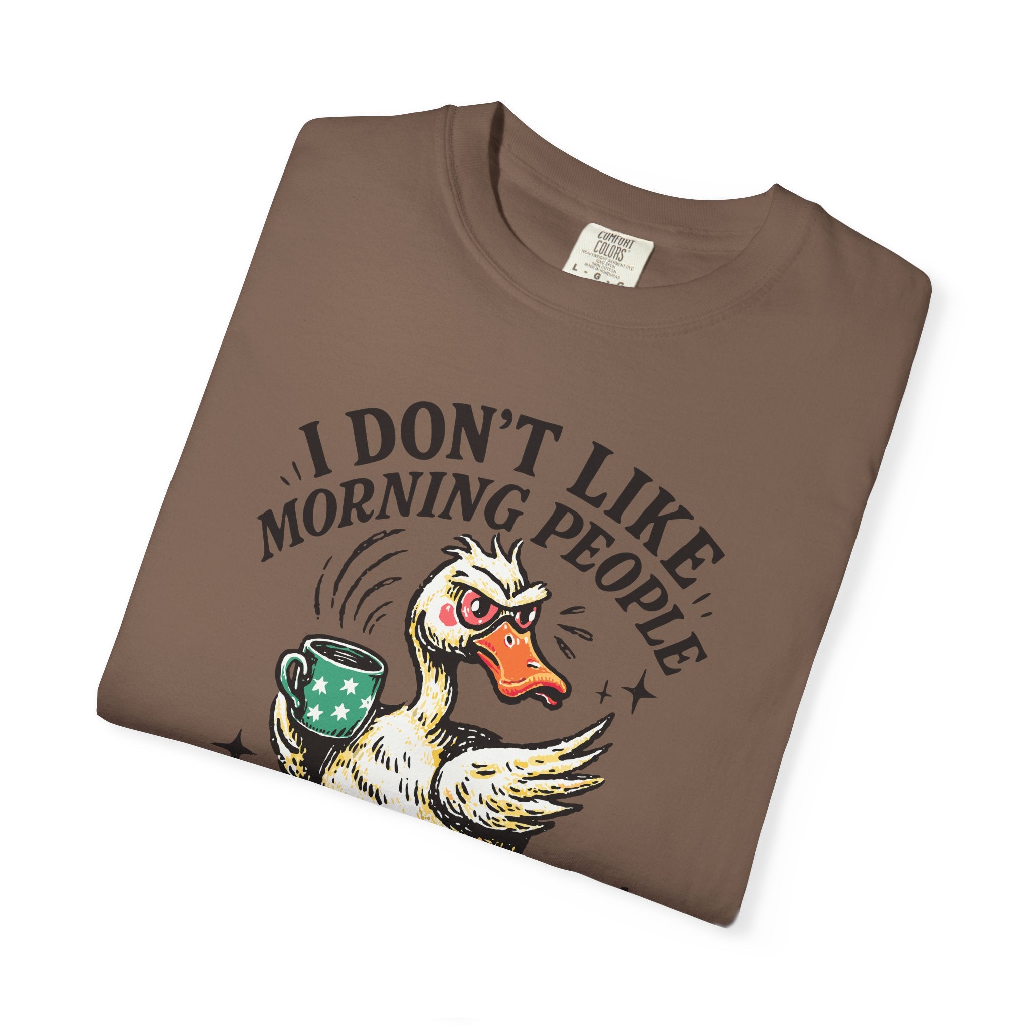 Brown t-shirt featuring a grumpy duck holding a coffee mug with the text I Don't Like Morning People