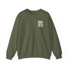 An olive green crewneck sweatshirt featuring the text Drip With Sarcasm on the left chest.