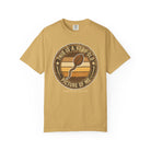 Mustard yellow t-shirt with a vintage-style graphic of a coffee bean shaped like a sperm cell.