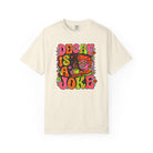 Cream-colored t-shirt featuring a retro psychedelic graphic that says Decaf Is A Joke.