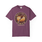 Purple t-shirt with a vintage-style graphic of a coffee bean shaped like a sperm cell.