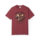 Red t-shirt featuring a graphic of a cowboy rooster pouring coffee with the text Rise & Shine.