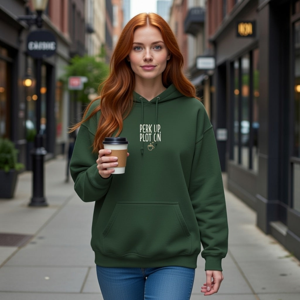 A woman in a green Perk Up Plot On hoodie holds a coffee cup while walking down a city street.