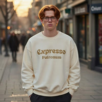 A man wearing a cream crewneck sweatshirt with the golden text Expresso Patronum on the chest.