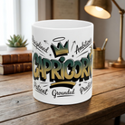 White ceramic Capricorn zodiac mug with graffiti-style lettering on a wooden desk.