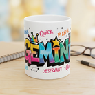 White ceramic Gemini zodiac mug with colorful graffiti-style lettering and personality traits.
