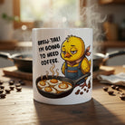 White ceramic mug featuring a tired cartoon chick and the pun Brew-tal! I'm going to need coffee.