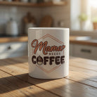 White ceramic mug featuring the text Mama Needs Coffee with a small coffee cup icon.