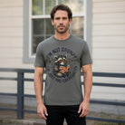 Man wearing a grey t-shirt with a raccoon reading a book and the text I'm not grumpy.