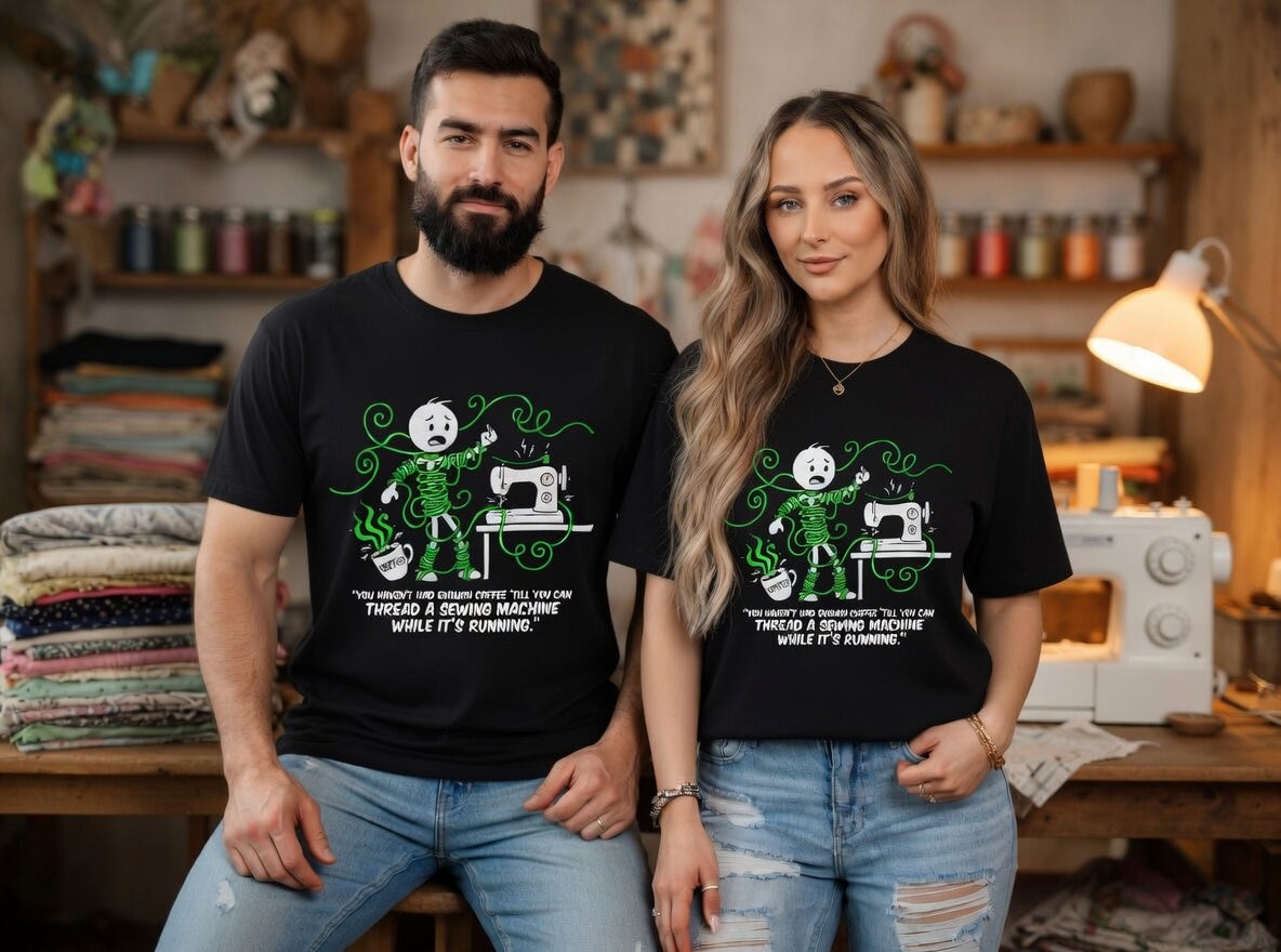 A man and woman wearing black t-shirts with a funny sewing-themed graphic and text.