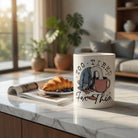 White ceramic mug featuring an illustration of an exhausted goose with the text Too Tired For This.