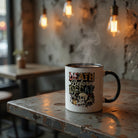 White ceramic coffee mug with a retro skull graphic and Death Before Decaf text.