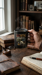 Black ceramic coffee mug featuring a skull design and the text Death Before Decaf.