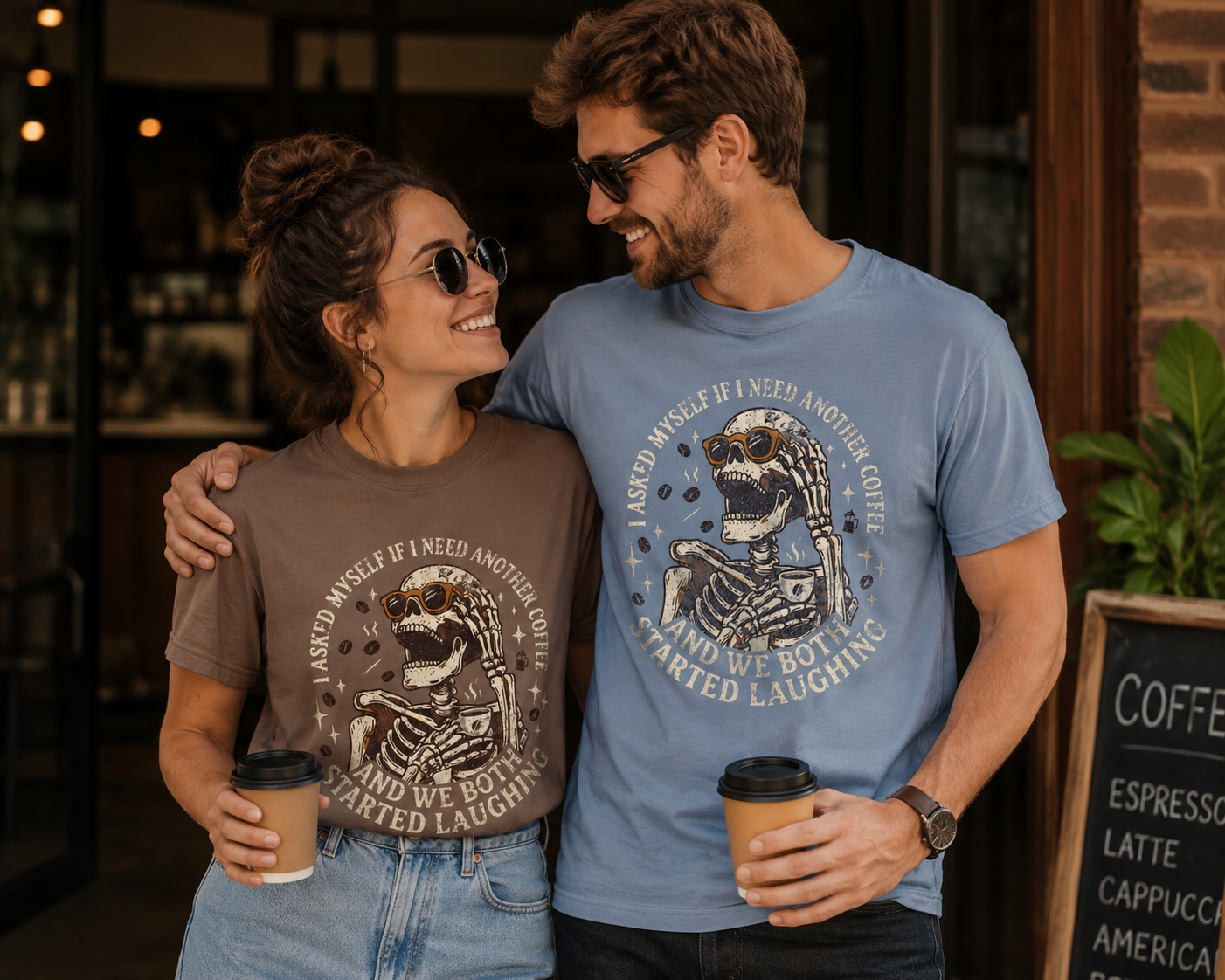 A man and woman wearing Skeleton Coffee Tees with a distressed graphic and dark humor quote.
