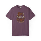 A plum-colored t-shirt featuring a distressed graphic that says Be Like Coffee Calm and Caffeinated.
